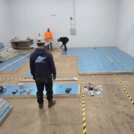 Projects 9 Construction workers setting up flooring