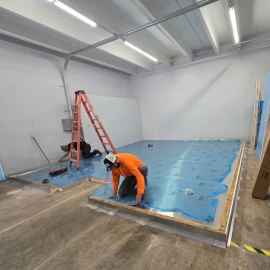 Projects 10 Construction workers installing flooring